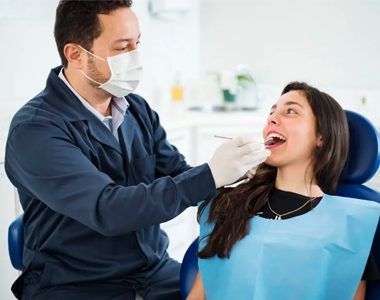 Women testing a teeth with the doctor